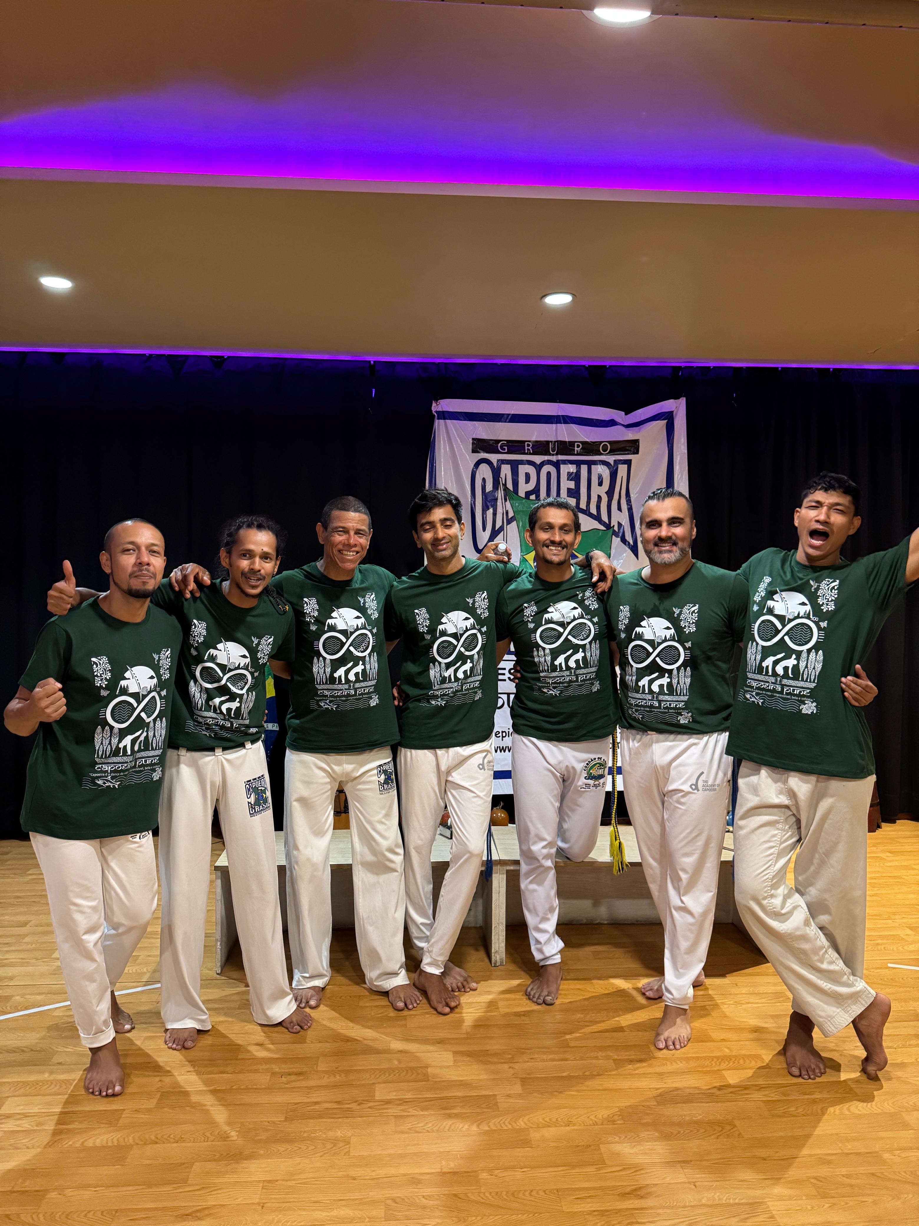 Capoeira group together with instruments